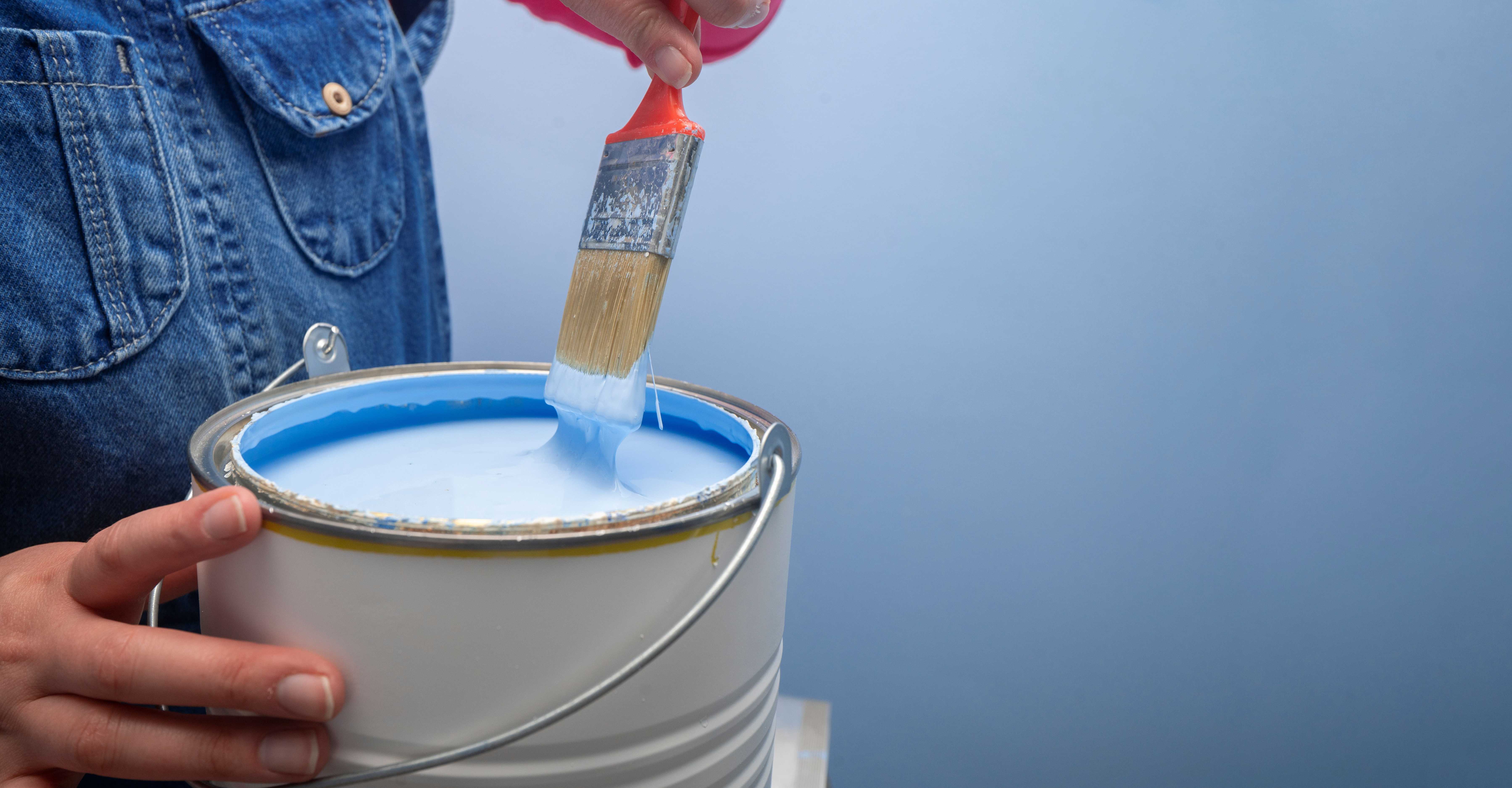 woman using primer paint